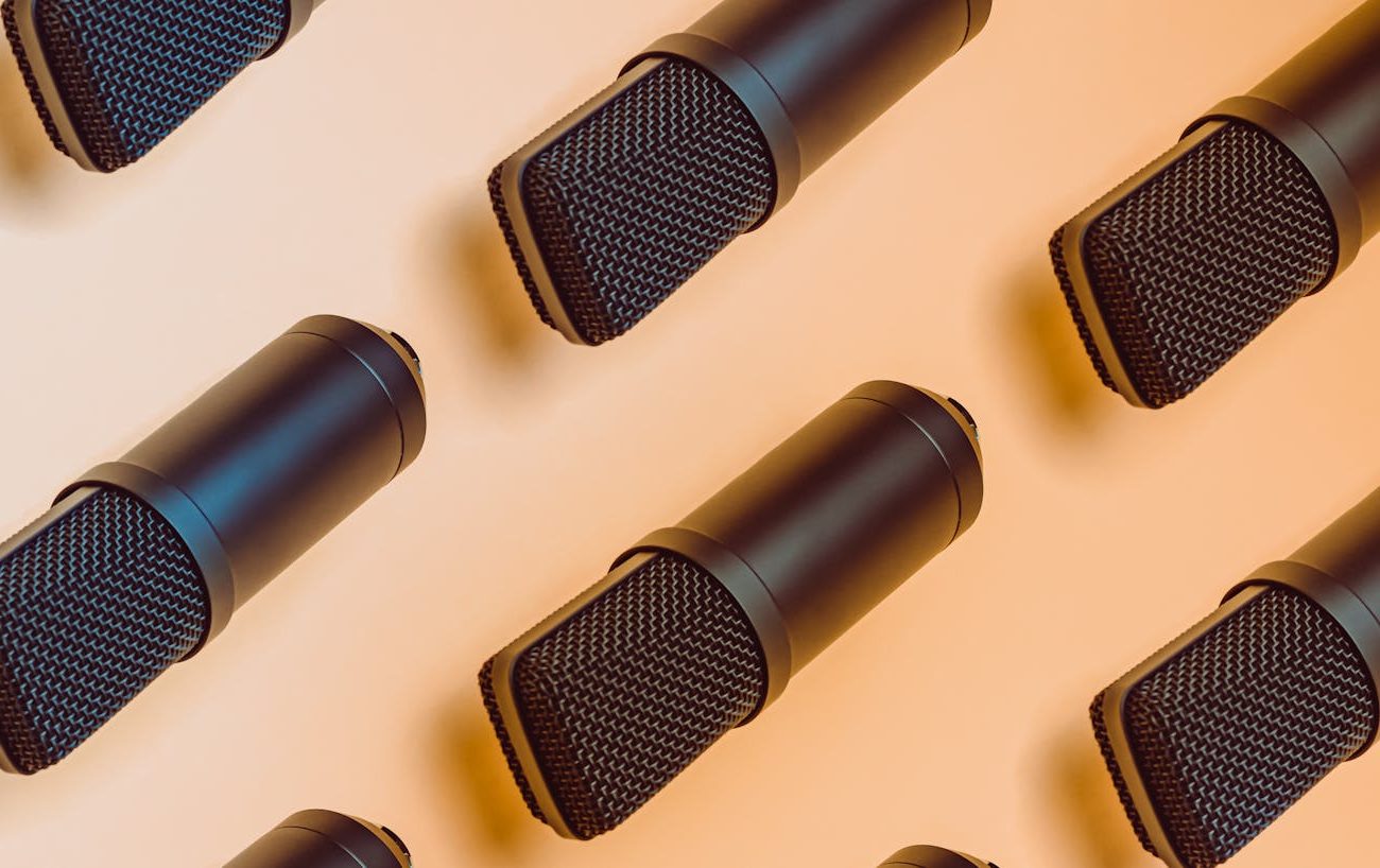 black microphones on white surface